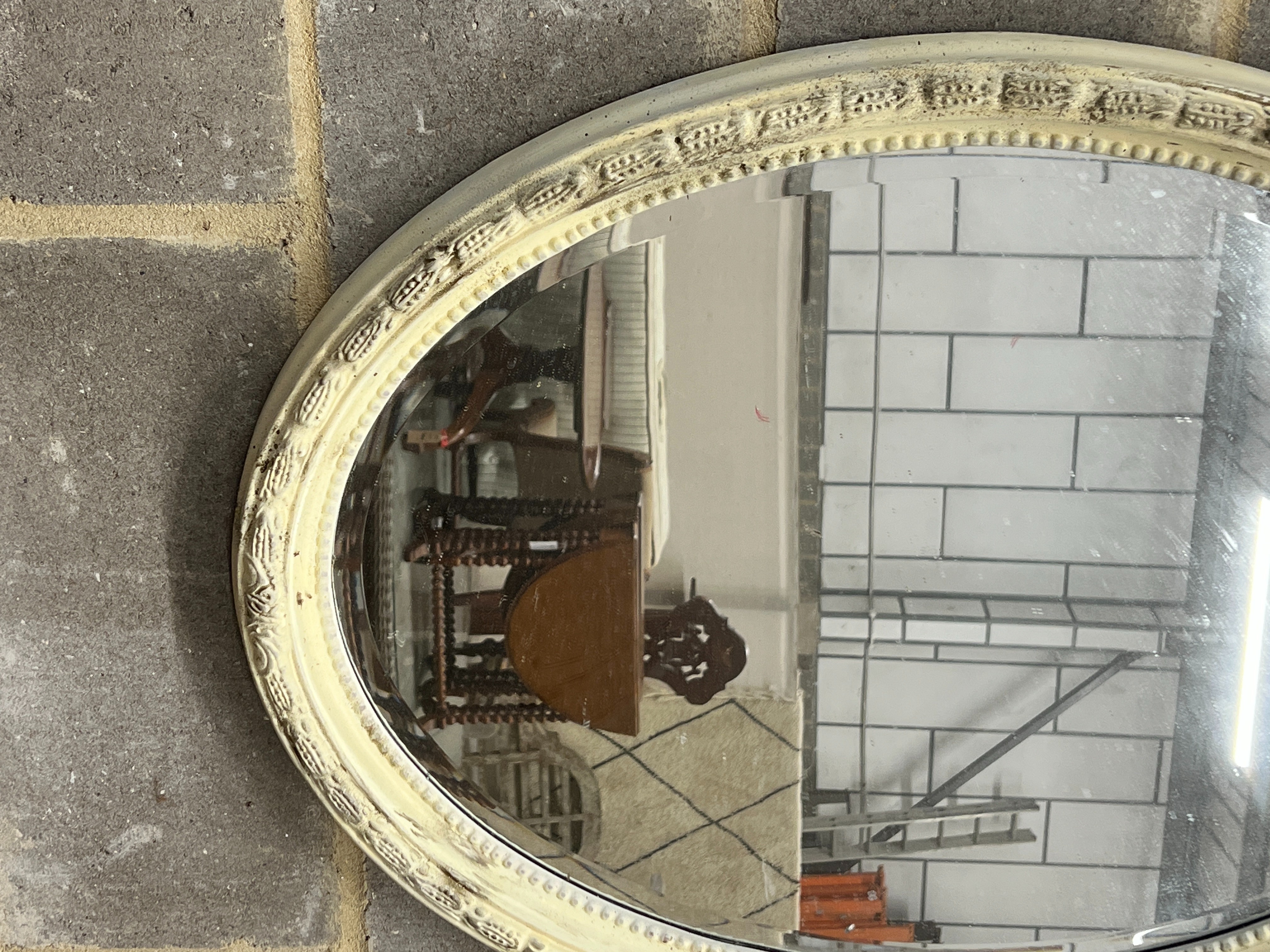 A Victorian style oval painted wall mirror, width 58cm, height 84cm